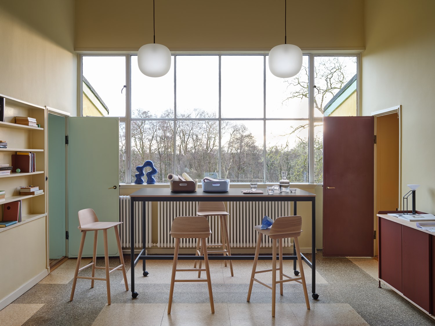 Base High Table w. Castors 190x85 cm H105 in Black - Nerd Bar Chair in Oak - Enfold Sideboard 148x45 cm H85 in Deep Red - Rime Pendant Ø37 cm in Deep Red - Restore Tray in Brown Green and Light Blue - Raise Carafe & Glasses in Clear - Piton Portable Lamp in Black - Compile Bookend in Deep Red Base High Table w. Castors 190x85 cm H105 in Black - Nerd Bar Chair in Oak - Enfold Sideboard 148x45 cm H85 in Deep Red - Rime Pendant Ø37 cm in Deep Red - Restore Tray in Brown Green and Light Blue - Raise Carafe & Glasses in Clear - Piton Portable Lamp in Black - Compile Bookend in Deep Red