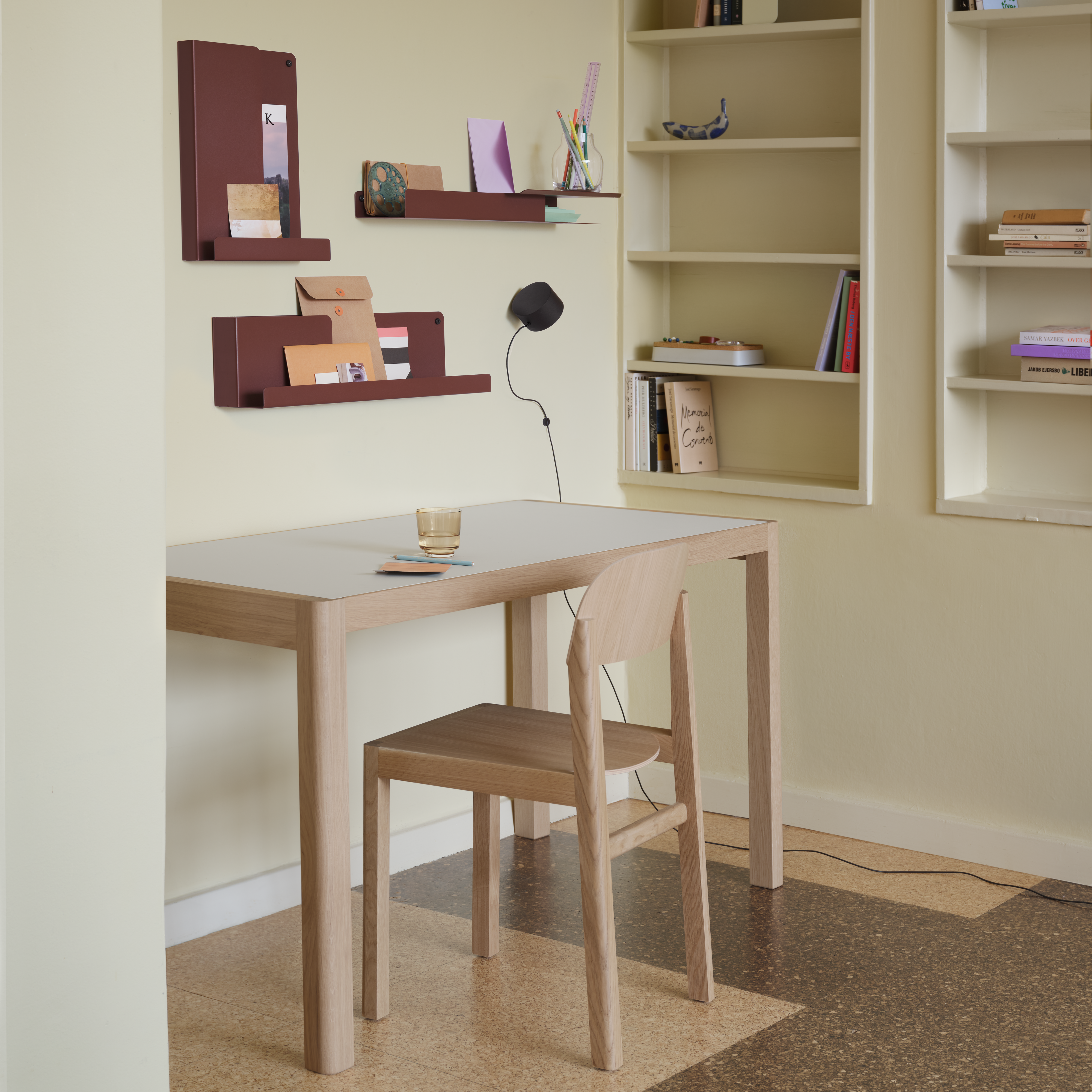 Folded Shelves in Deep Red - Workshop Table 130 cm in Warm Grey Linoleom/Oak - Workshop Chair in Oak - Post Wall Lamp in Black - Silent Vase Ø11 cm in Clear - Raise Glass in Burnt Orange - Arrange Desktop Series Tray in Grey