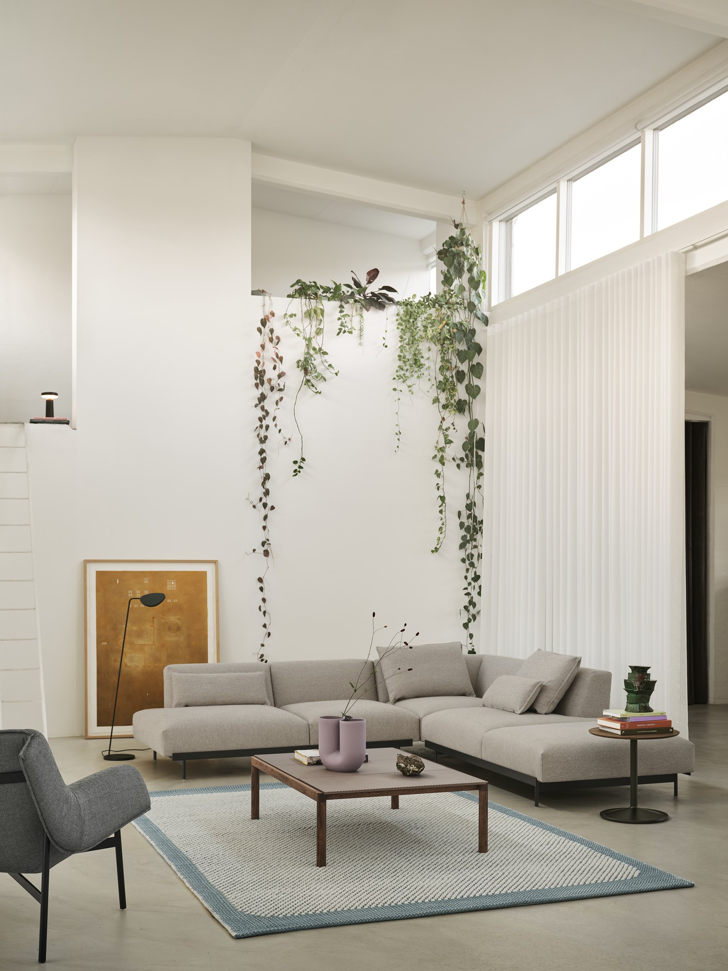 In-Situ Modular Sofa Config. 4 in Clay 12, Pebble Rug 200x300 cm in Pale Blue, Couple Coffee Table 120x84x35 cm 2 Plain 1 Wavy in Taupe/Dark Oiled Oak, Leaf Floor Lamp in Dark Green, Ease Portable Lamp in Black, Soft Side Table in Dark Stained Brown/Black, Wrap Lounge Chair in Sabi 151/Black, Kink Vase in Dusty Lilac In-Situ Modular Sofa Config. 4 in Clay 12, Pebble Rug 200x300 cm in Pale Blue, Couple Coffee Table 120x84x35 cm 2 Plain 1 Wavy in Taupe/Dark Oiled Oak, Leaf Floor Lamp in Dark Green, Ease Portable Lamp in Black, Soft Side Table in Dark Stained Brown/Black, Wrap Lounge Chair in Sabi 151/Black, Kink Vase in Dusty Lilac