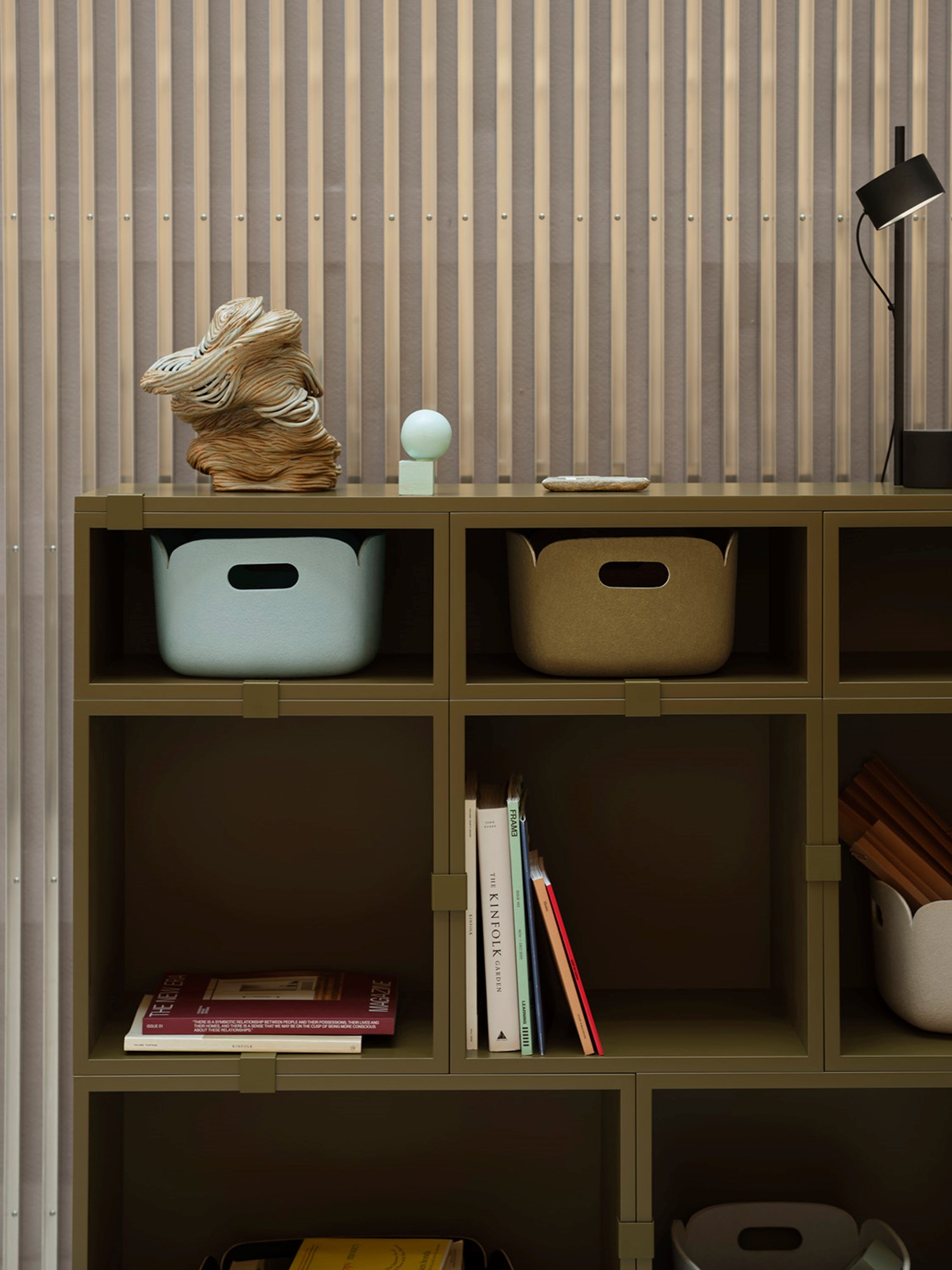 The brown-green Stacked storage system, paired with Restore Baskets, offers a stylish and functional solution for organizing your space in a modern, minimalist way The brown-green Stacked storage system, paired with Restore Baskets, offers a stylish and functional solution for organizing your space in a modern, minimalist way