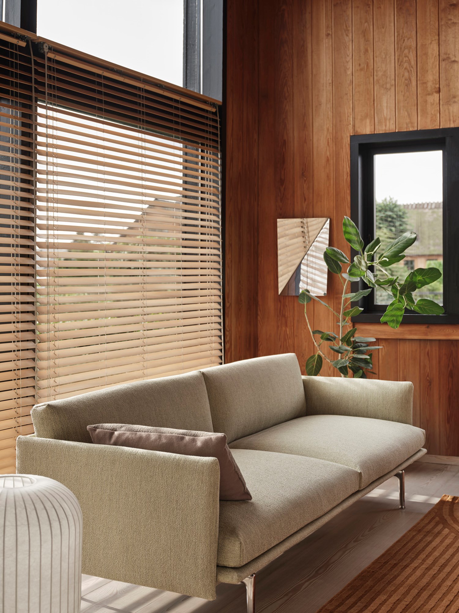 Muuto Outline Sofa, styled with a gaze mirror and Strand table lamp H59. Offers a cozy, sophisticated ambiance for any living room. Muuto Outline Sofa, styled with a gaze mirror and Strand table lamp H59. Offers a cozy, sophisticated ambiance for any living room.