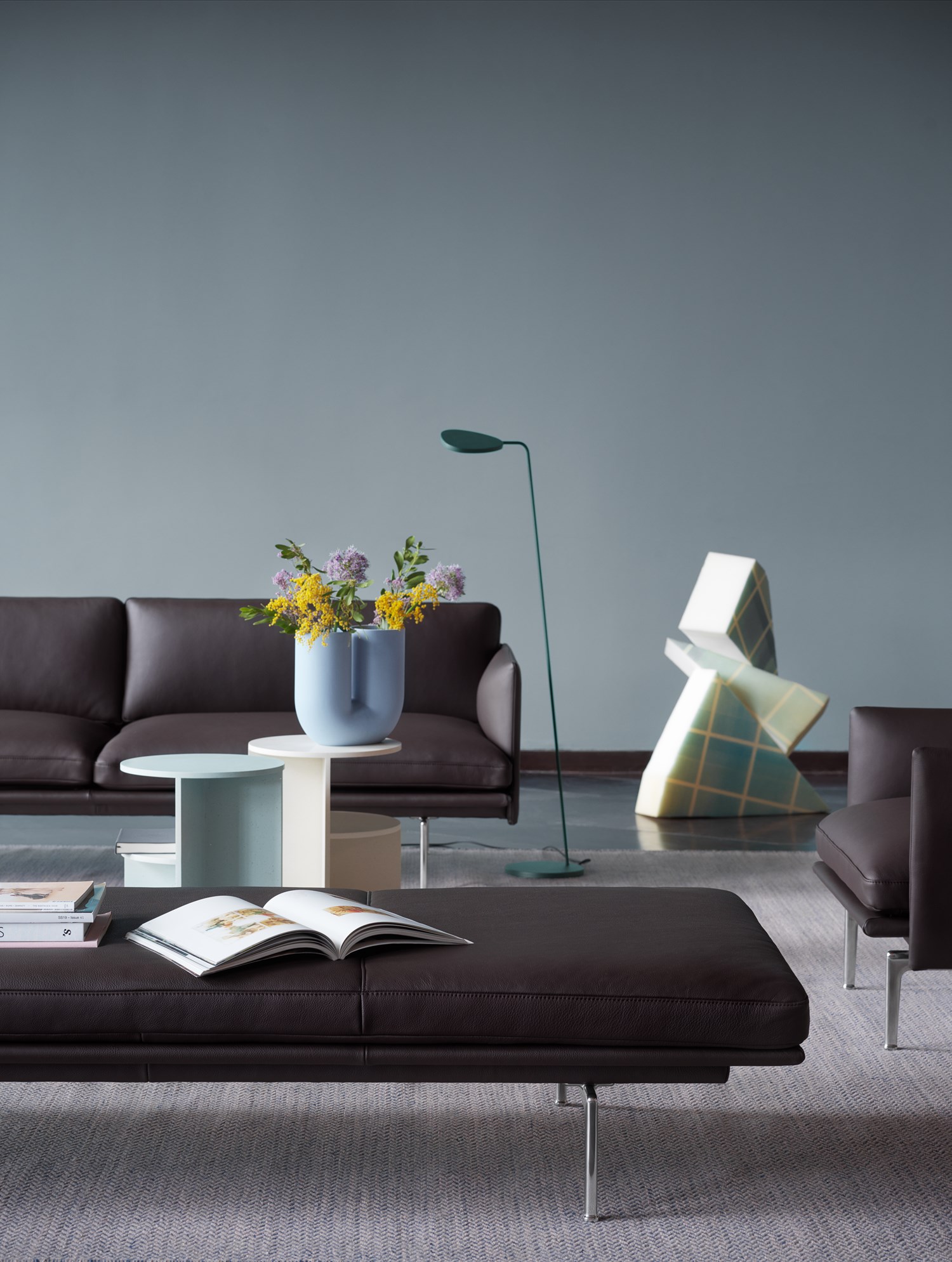 A modern setting featuring Outline Daybed in Easy Leather with aluminium legs, styled with the Kink Vase and Halves Side Table A modern setting featuring Outline Daybed in Easy Leather with aluminium legs, styled with the Kink Vase and Halves Side Table