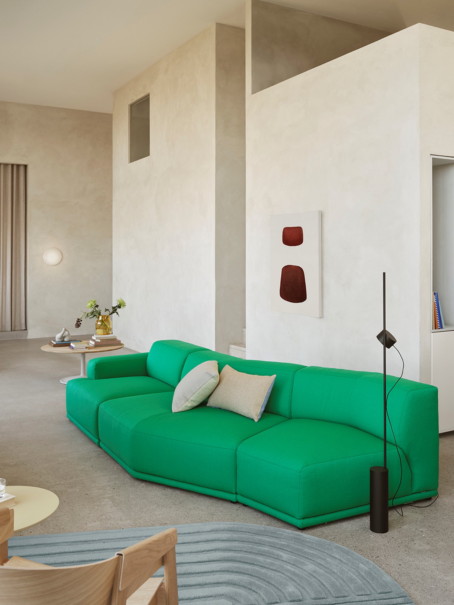 A Connect Soft Modular Sofa in Vidar 932 fabric, arranged with a Post Floor lamp, a Mingle Soft coffee table, and a Relevo Cover Lounge rug. A Connect Soft Modular Sofa in Vidar 932 fabric, arranged with a Post Floor lamp, a Mingle Soft coffee table, and a Relevo Cover Lounge rug.