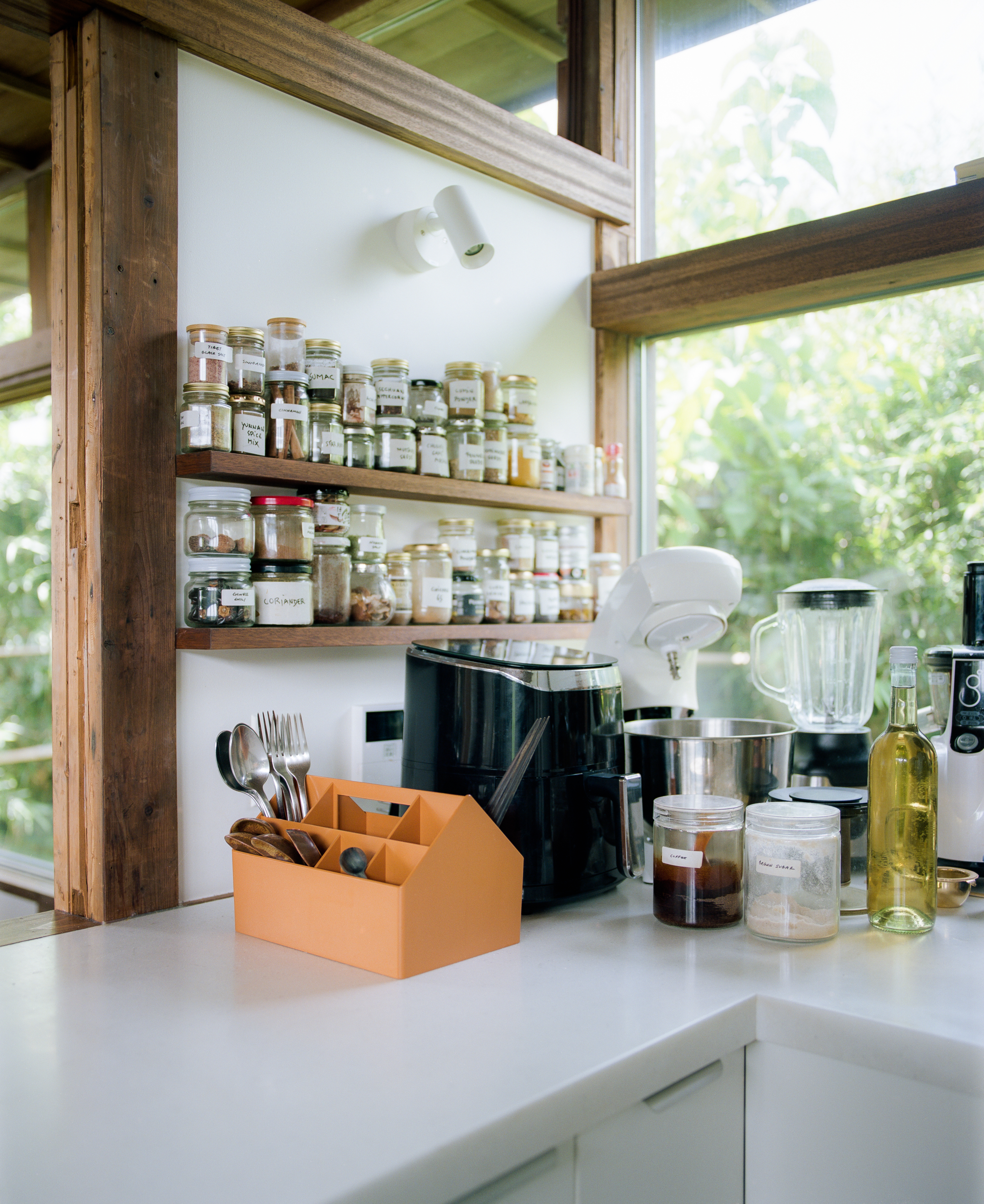 Kitchen counter with various jars, cooking utensils inside the Sketch Toolbox. 