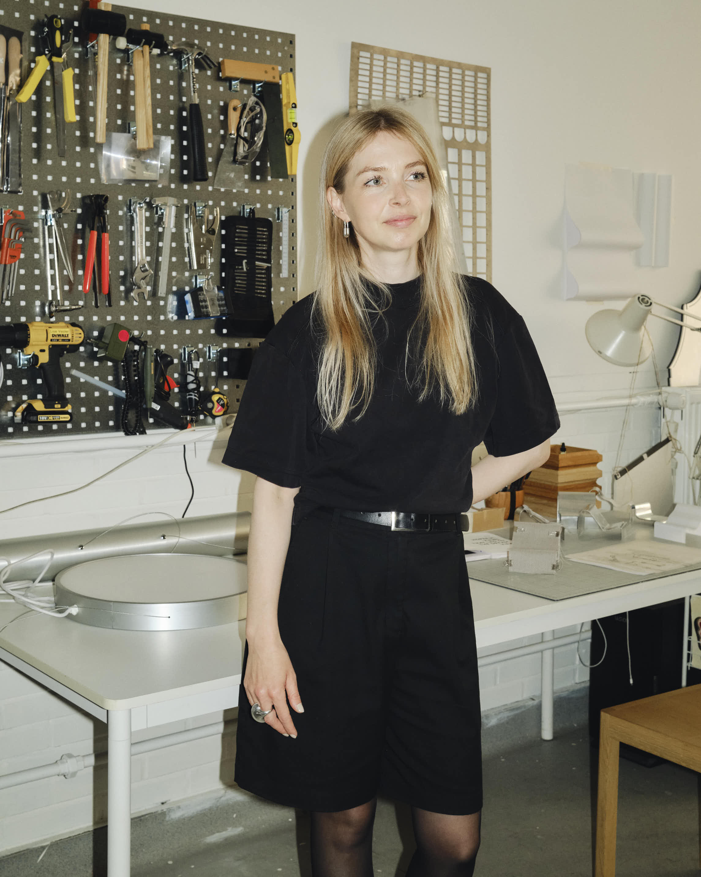 Portrait of designer Lise Vester taken during a studio visit, capturing her in a bright, creative setting that reflects her thoughtful and material-driven design approach.