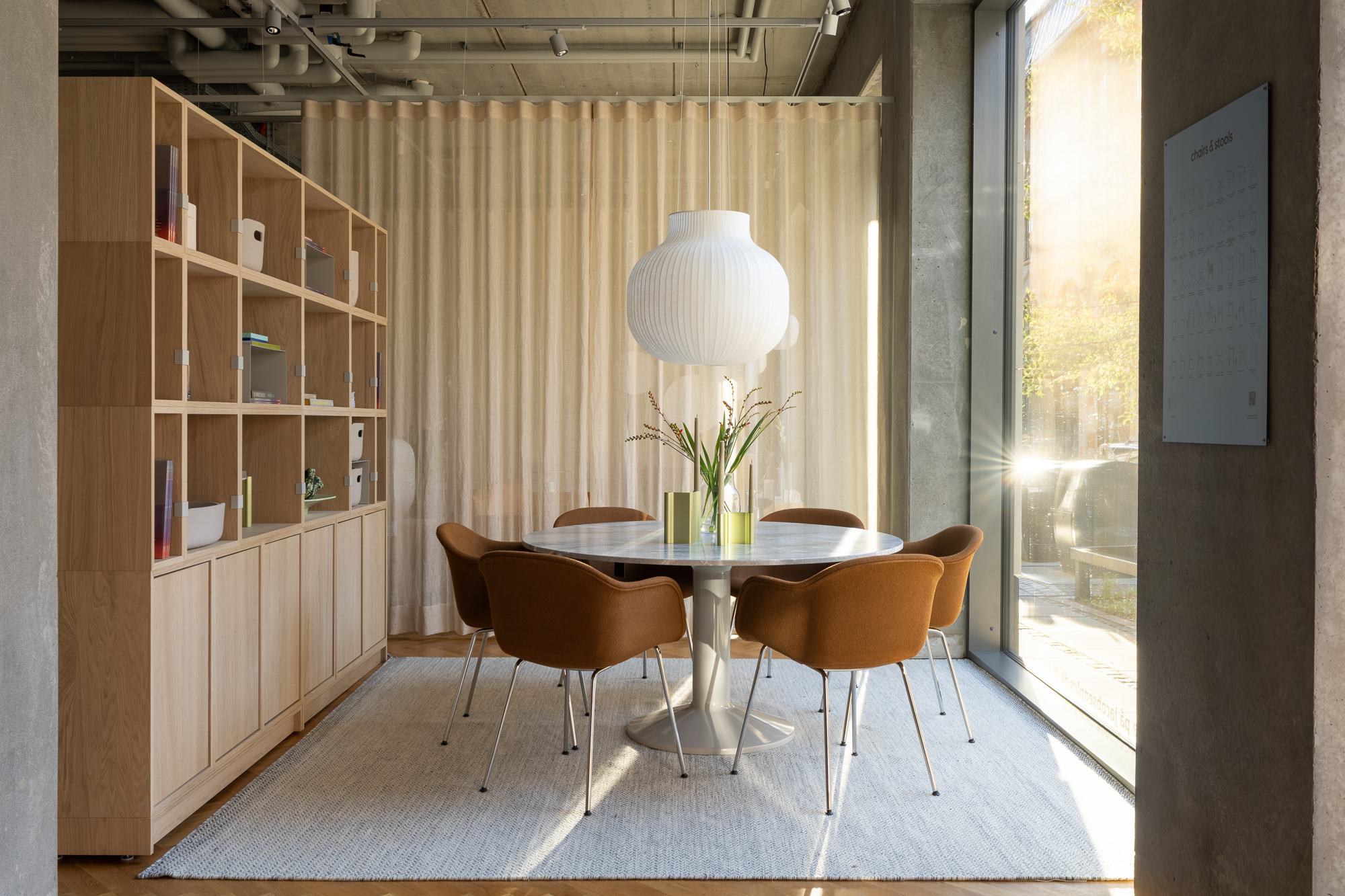 This is a dining setting with Midst Table, Fiber Chair and Strand Pendant. 