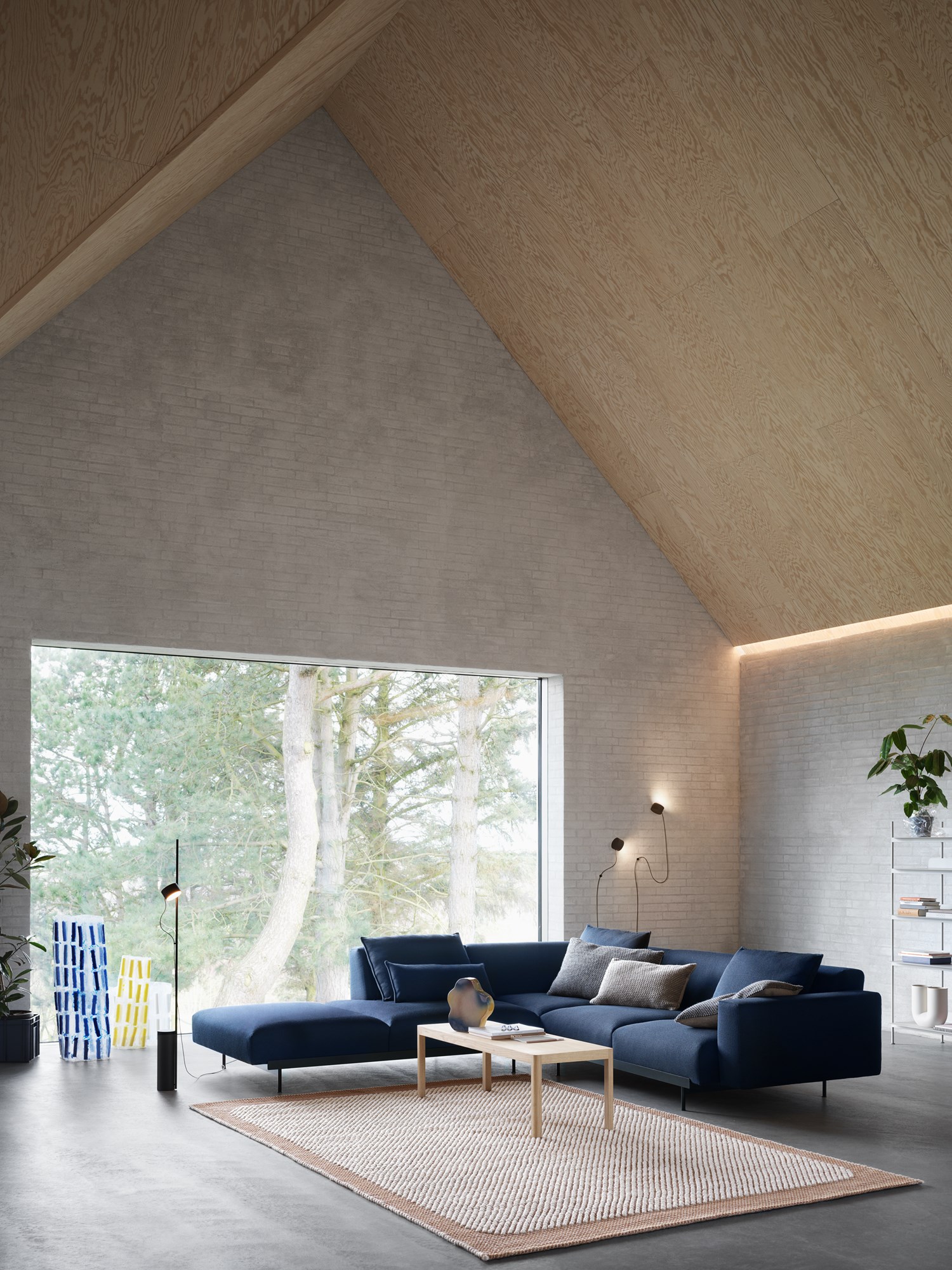 Modern Living Space featuring the In Situ corner sofa in Vidar 554, an orange Pebble Rug, oak Workshop Coffee Table, and Post Floor Lamp. Modern Living Space featuring the In Situ corner sofa in Vidar 554, an orange Pebble Rug, oak Workshop Coffee Table, and Post Floor Lamp.